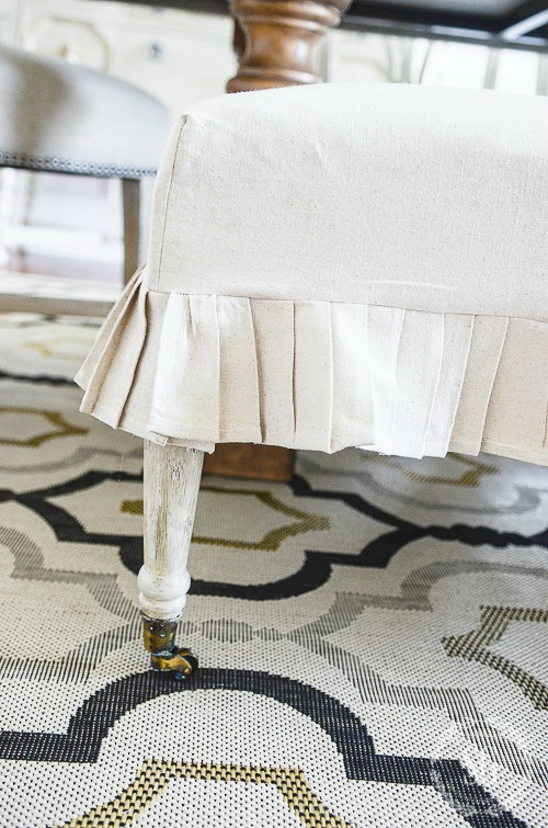 EASY DROPCLOTH SLIPCOVER-Here's an EASY. step-by-step diy to make a pretty slipcover from a painter's dropcloth. If you can sew a straight line, YOU CAN make this!