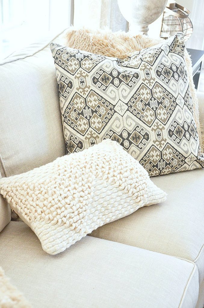 neutral pillows on sofa