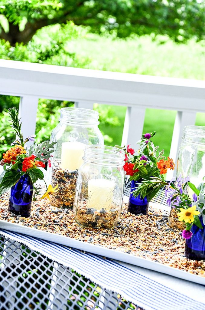 mason jar outdoor lanterns on a porch