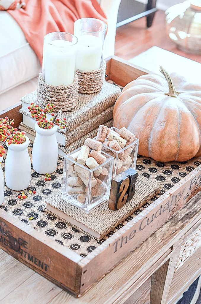 A VIGNETTE WITH A BIG PUMPKIN AND BITTERSWEET- GREAT FALL DECORATING IDEA