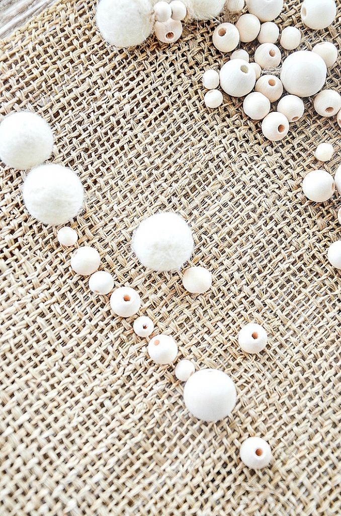 white wooden balls and wool balls