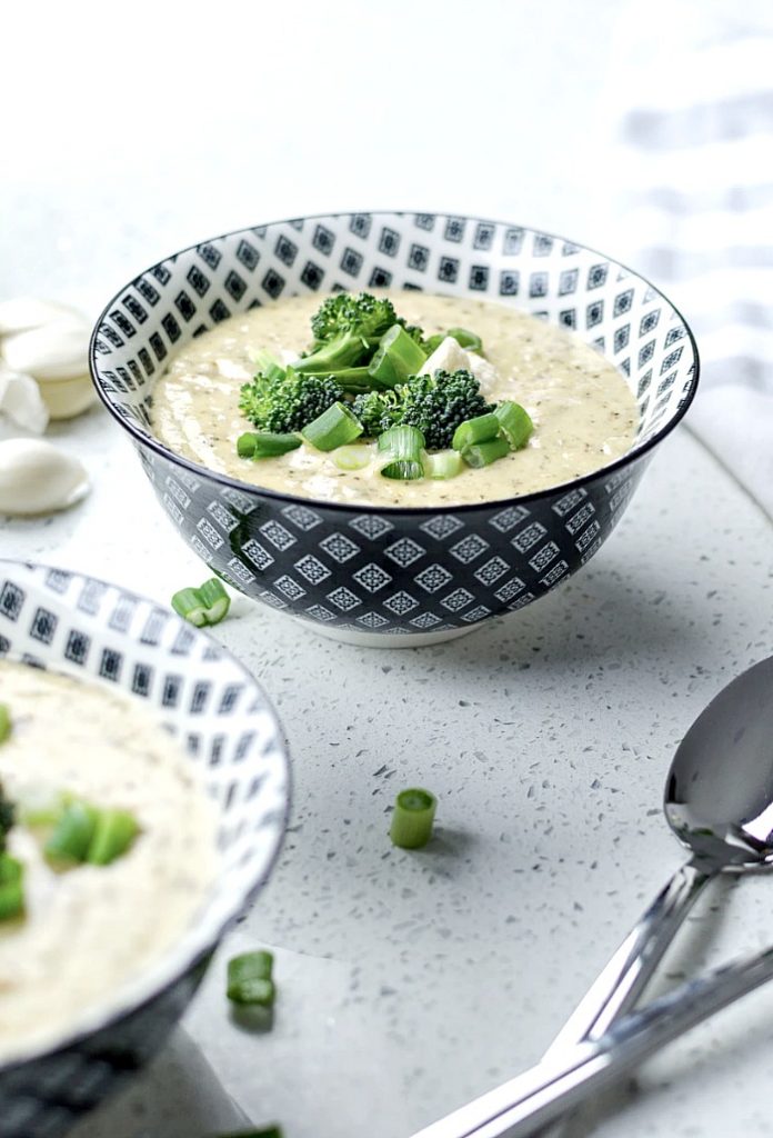 broccoli  cheese soup in blue and white bowls