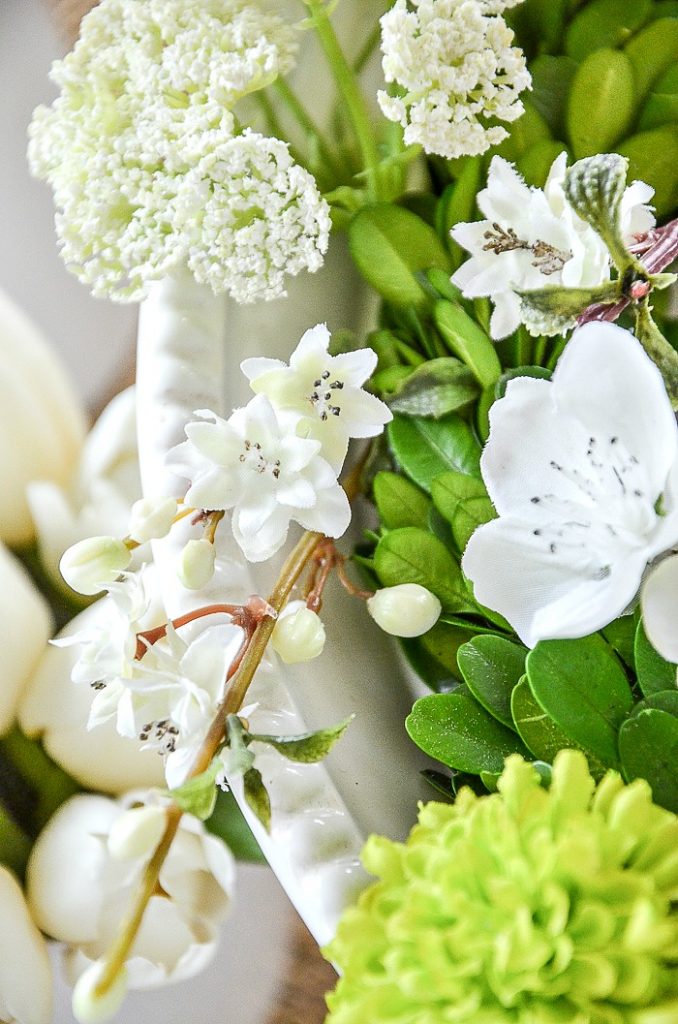 ADDING SPRINGS OF FLOWERS TO SPRING ARRANGEMENT