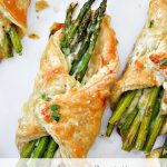 a asparagus bundle with brie cheese and honey