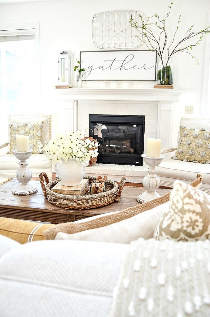 a white fireplace with a gather sign above it as part of a summer home tour