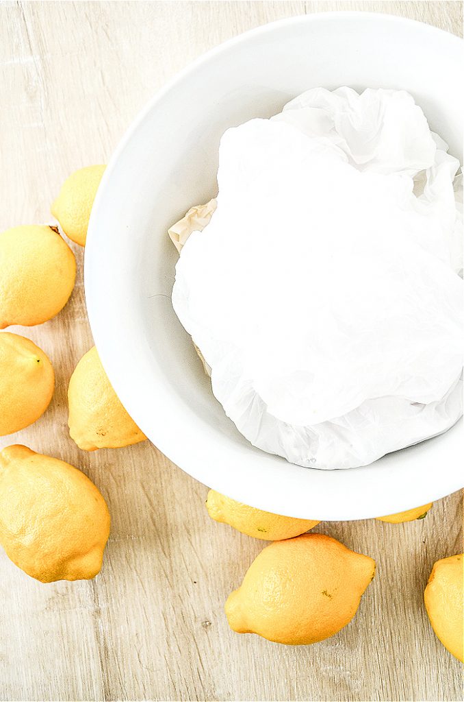 lemons, white bowl and paper bags to make a pretty arrangement