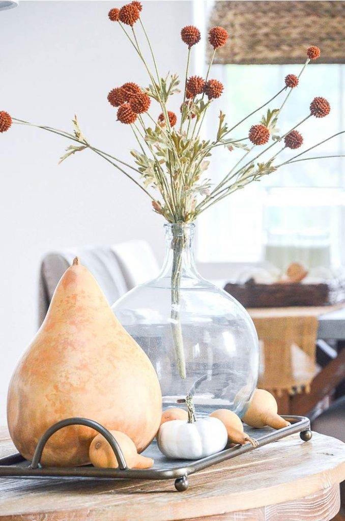 BIG DRIED GOURD AND A VASE OF SEED PODS
