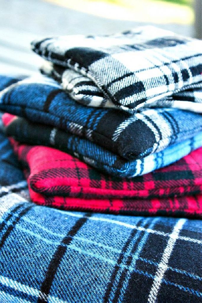 PILE OF FLANNEL HAND WARMERS