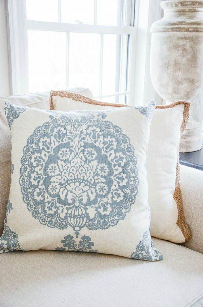 BLUE AND WHITE PILLOW ON A SOFA