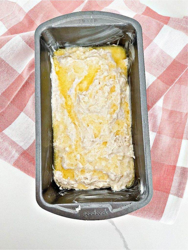 ADDING MELTED BUTTER TO THE TOP OF BATTER IN A LOAF PAN
