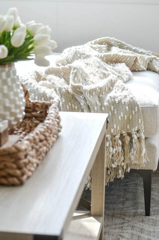 ACCENT DECOR- a throw blanket draped over the end of a sofa
