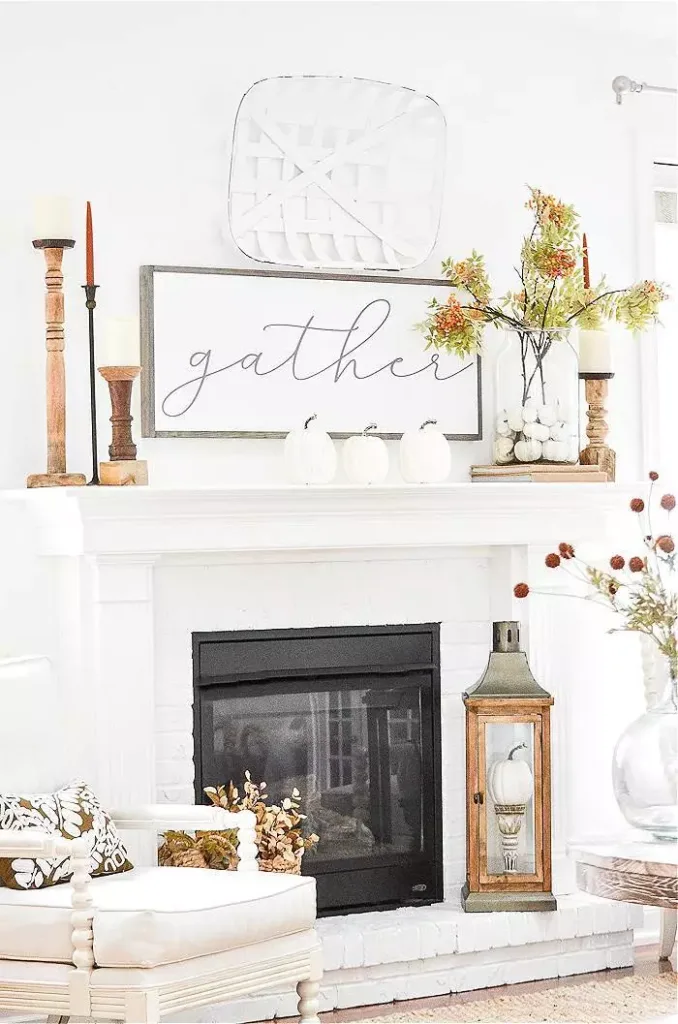 A FIREPLACE DECORATED FOR FALL WITH PRETTY FALL DECOR