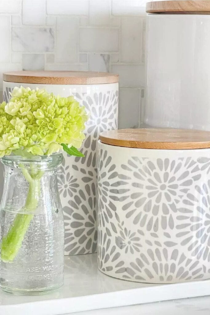 canisters and a little green hydrangea