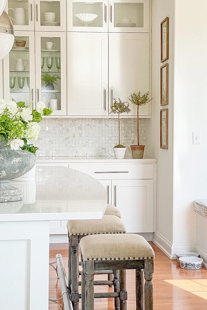 WHITE PAINT ON WALLS AND ON THE CABINETS IN THE KITCHEN