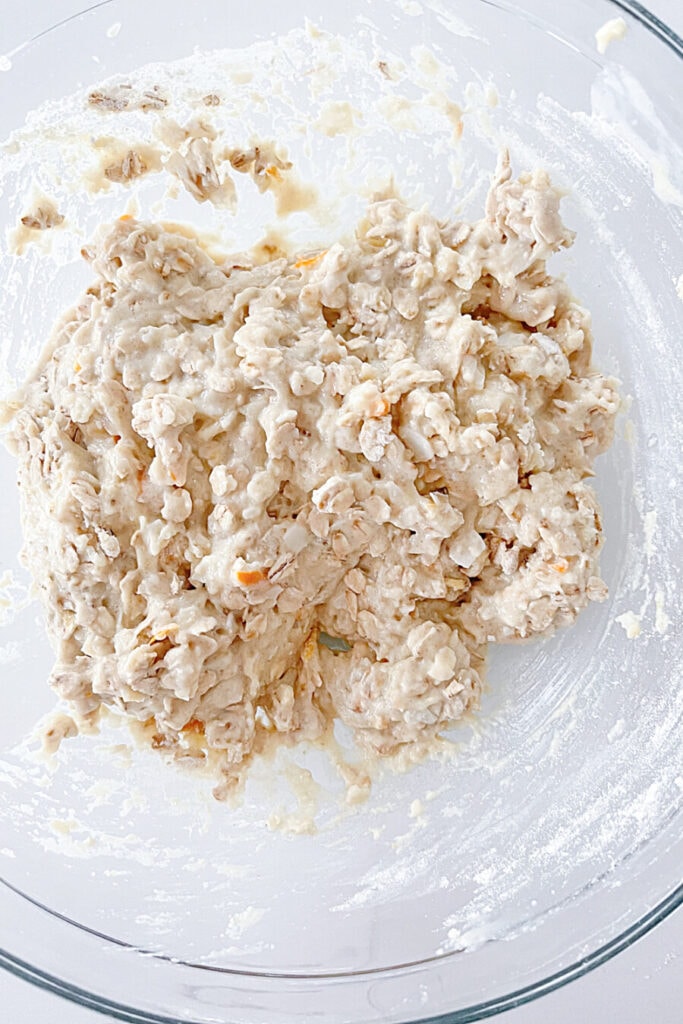 ORANGE OATMEAL INGREDIENTS MIXED IN A BOWL
