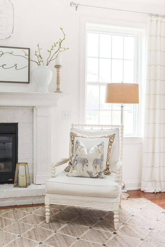 WHITE PAINT ON WALLS AND FIREPLACE IN THE LIVING ROOM