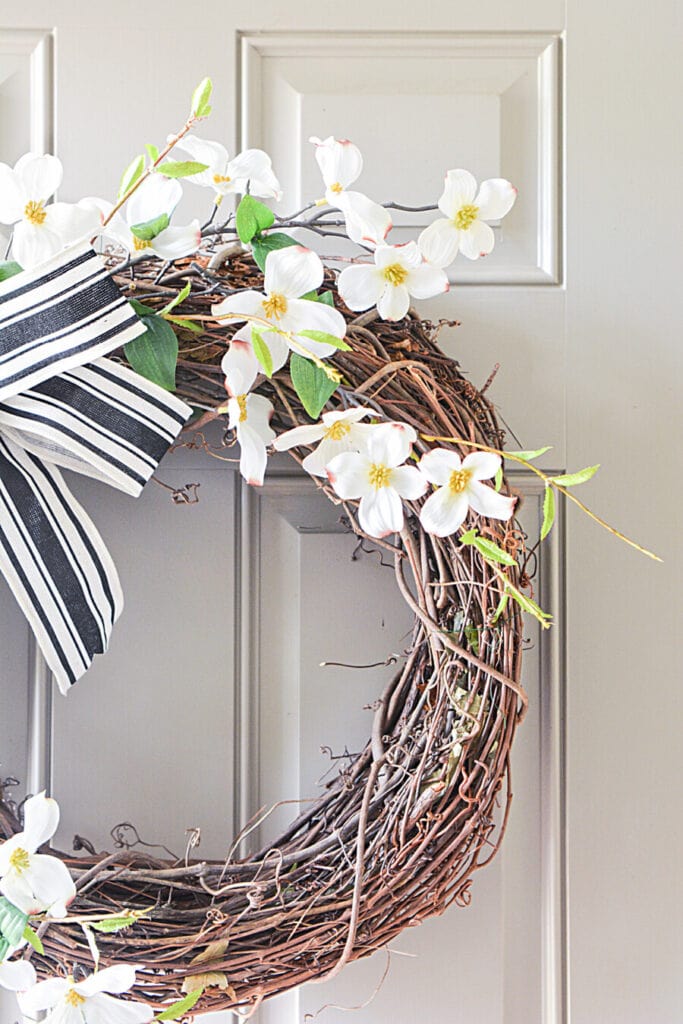 DOGWOOD WReath hanging on a front door