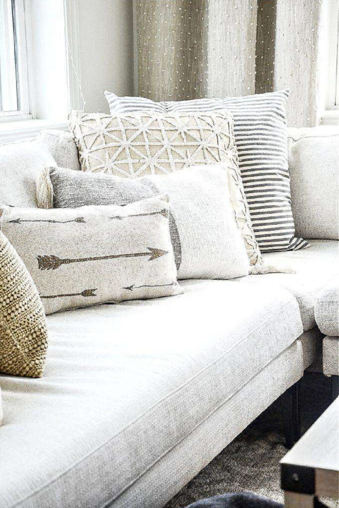 COLOR IN DECORATING- cool and warm pillows on a sectional