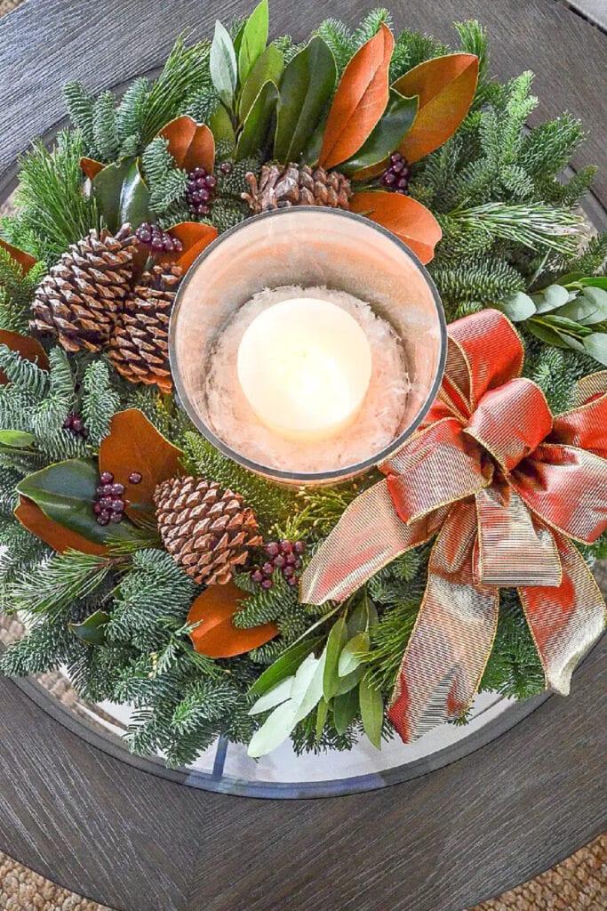 KEEPING LIVE CHRISTMAS GREENS FRESH- BEAUTIFUL WREATH USED AS A CENTERPIECE WITH A CANDLE
