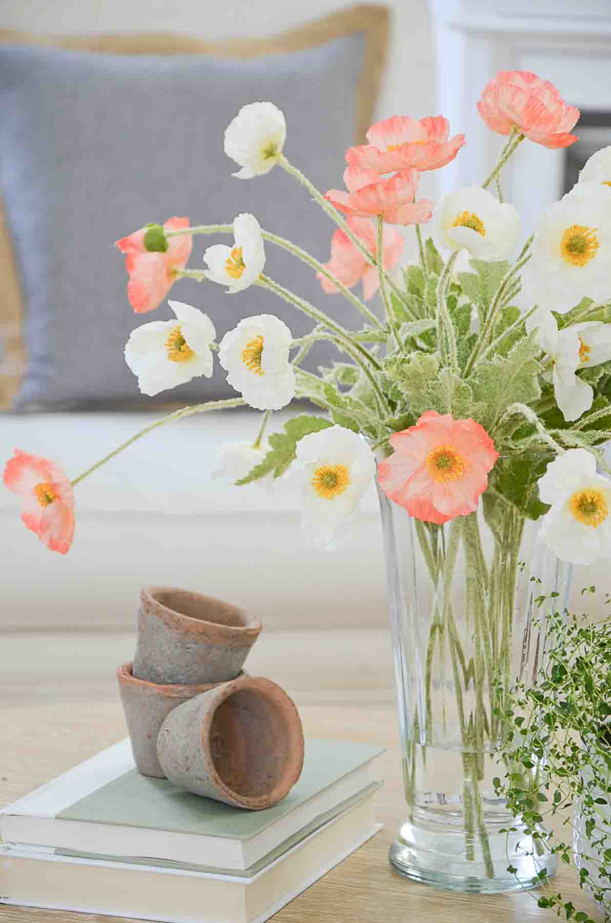 https://www.stonegableblog.com/wp-content/uploads/2023/01/FAUX-FLOWERS-salmon-and-white-poppies-in-a-glass-vase-13.jpg