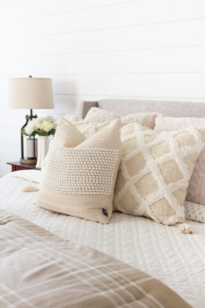 neutral pillows on a bed