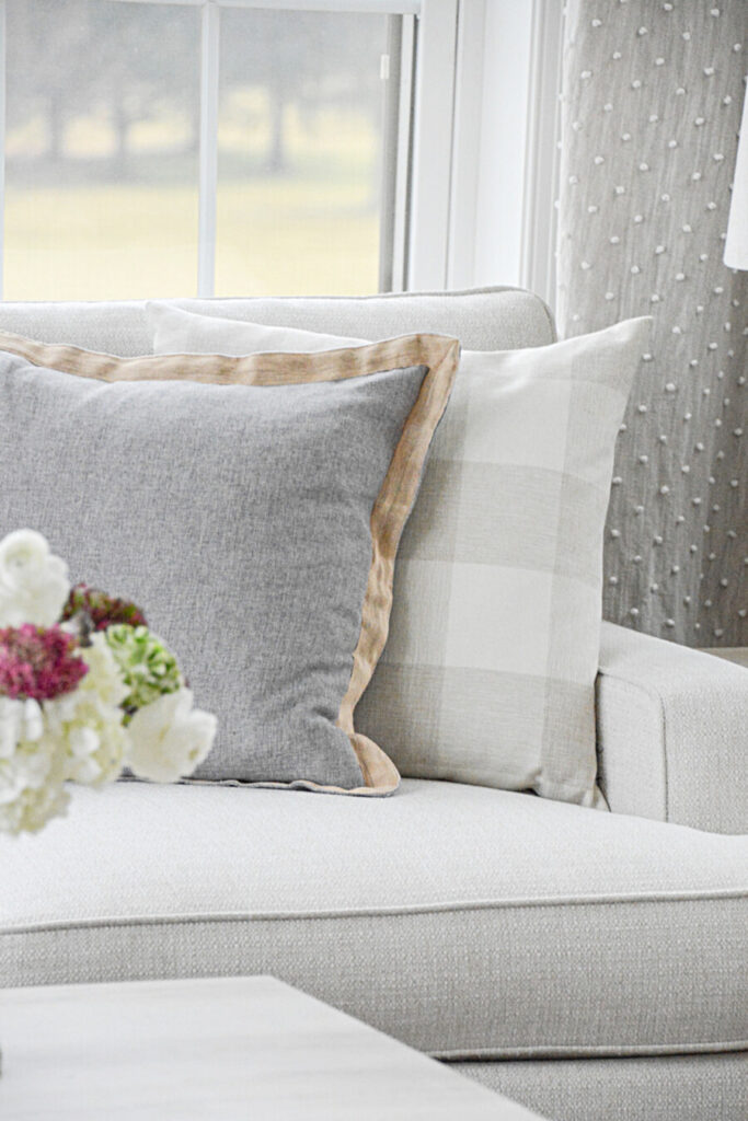 decorating cheaply- pillows on a sofa