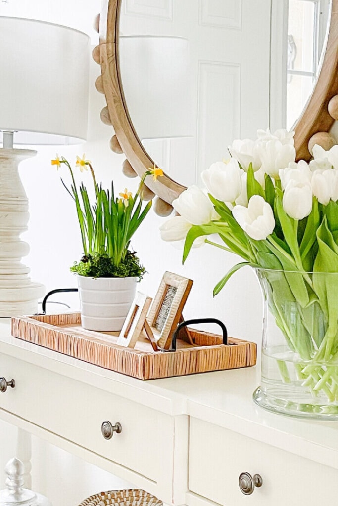 SPRING DECOR IDEAS- SPRING TETE-A-TETE DAFFODIL FLOWERS AND WHITE TULIPS ON A CONSOLE
