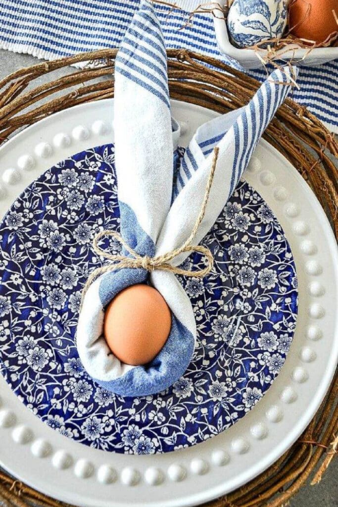EASTER TABLE DECOR- BUNNY NAPKIN FOLD ON BLUE AND WHITE PLATES