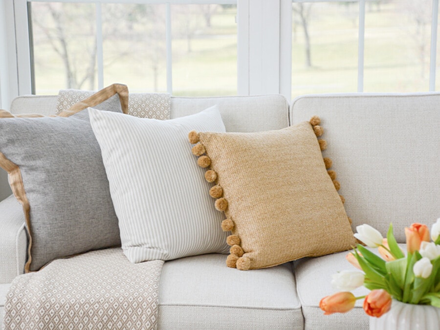 spring home tour-spring pillows on a sofa
