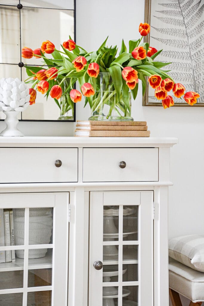 HOW TO DECORATE A BUFFET- ORANGE TULIPS ON A WHITE BUFFET