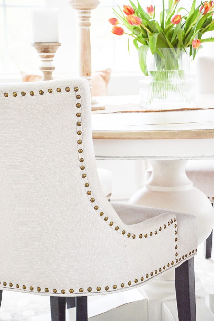 small dining room - dining room chairs with brass nailheads