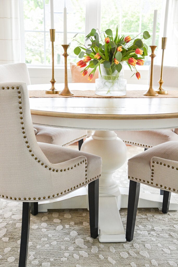 chairs with black legs in the dining room