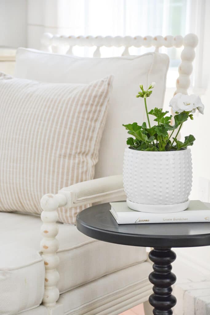 drink table with a white planter on it