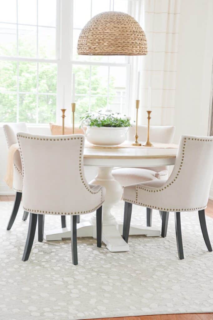 a dining room table with four chairs