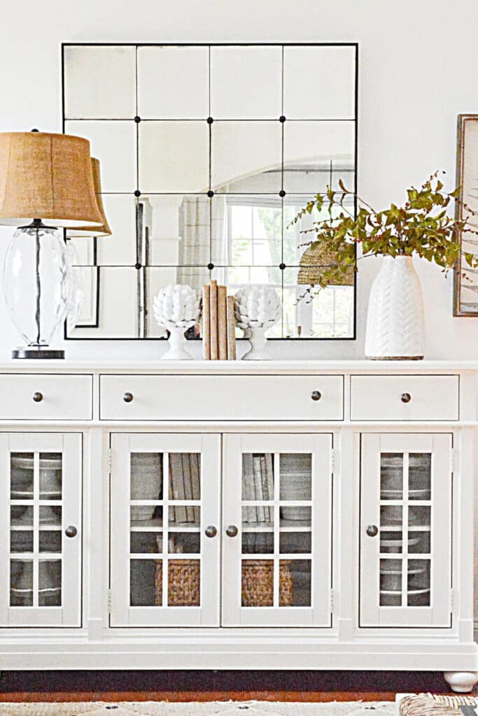 CLASSIC WHITE BUFFET WITH AN ANTIQUED MIRROR ABOVE IT