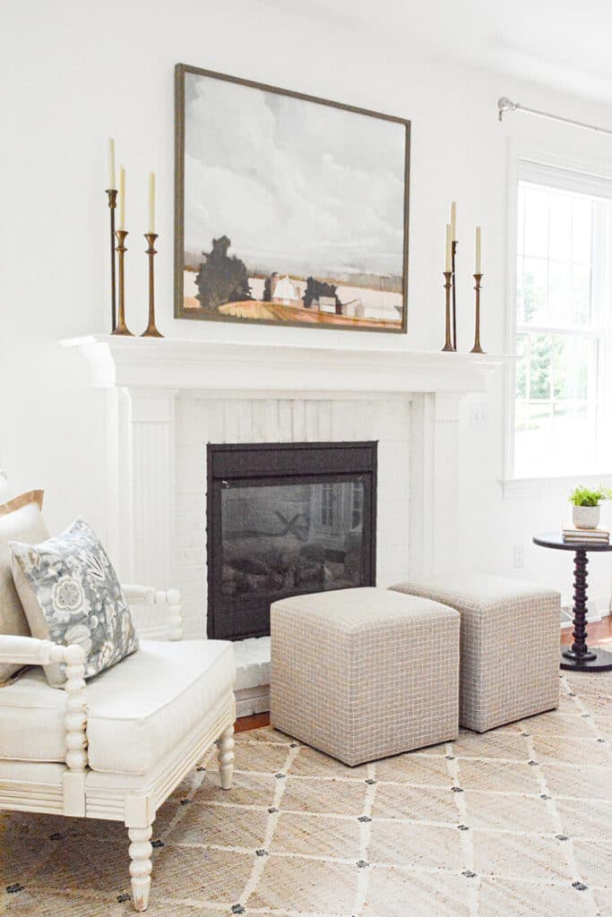 FIREPLACE WITH CLASSIC CHAIRS AND TRENDY UPHOLSTERED CUBES