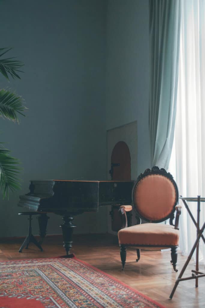 CLASSIC GRAND PIANO AND ORIENTAL RUG
