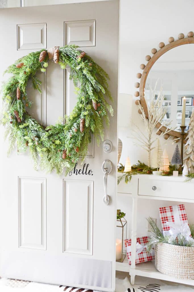 DECORATING WITH PINECONES-wreath on a front door