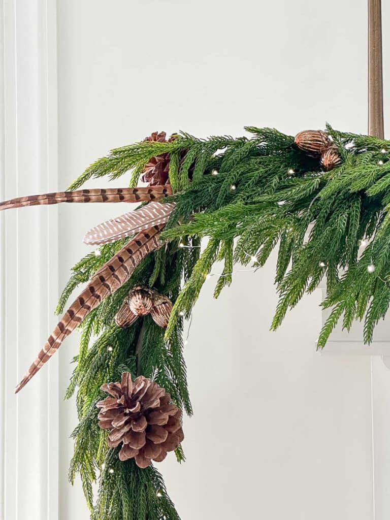 CHRISTMAS TRANSITIONAL WREATH- pheasant feathers  and ppinecenter grouping