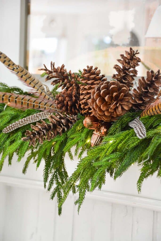 CHRISTMAS TRANSITIONAL WREATH- pheasant feathers  and ppine center grouping plus acorn oranements.