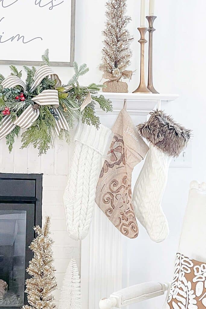 FAUX GREENS- on the mantel with Christmas stockings