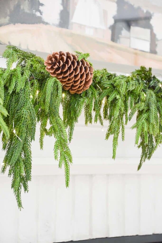 TRANSITIONAL CHRISTMAS MANTEL-pinecones wired to the garland