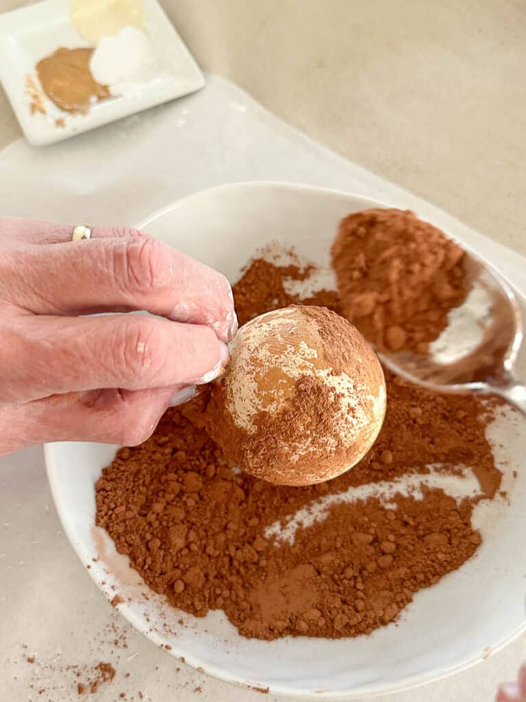 adding cocoa powder to the ball