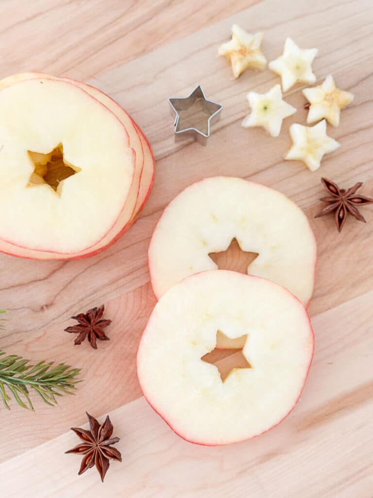 orange slices with stars cut out of the center of them