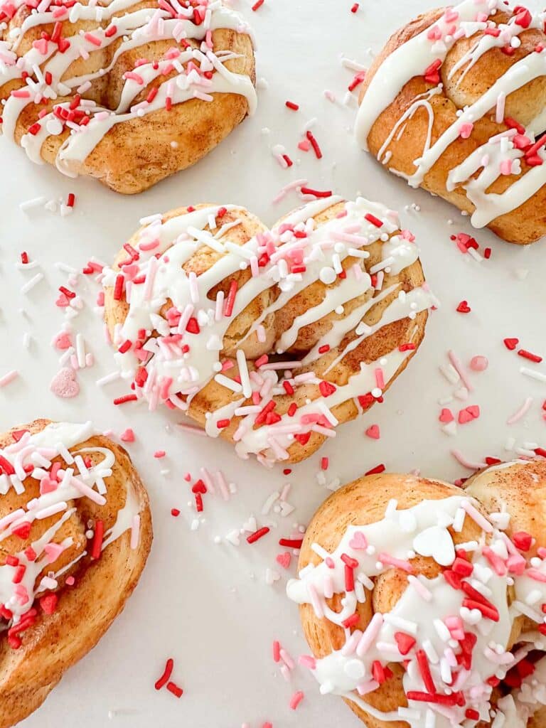 heart shaped cinnamon rolls with sprinkles