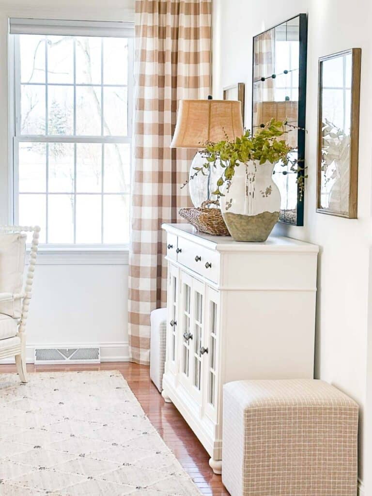 contrasting curtains and white buffet