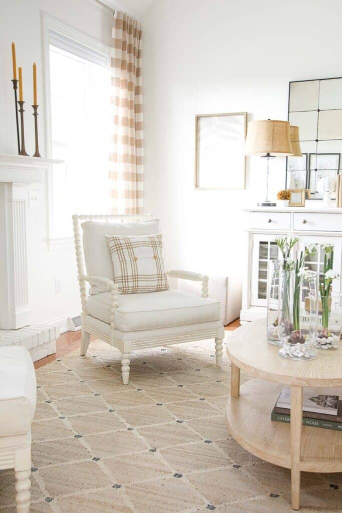 early spring decor- white chair with butterscotch and white pillows