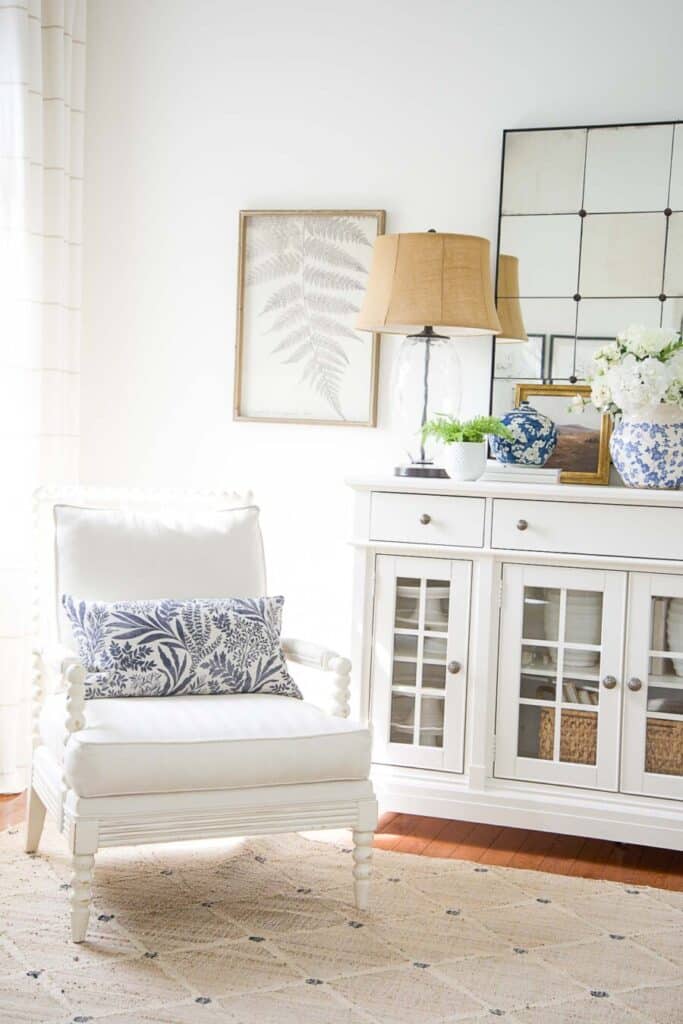 white buffet and white chair with blue accents